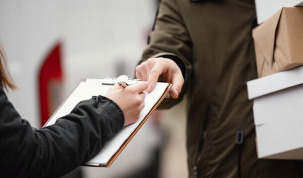 close-up-signing-package-delivery